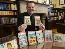 Father Ubel with baseball cards.